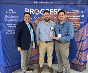 Tom Vesser from Froedtert Holy Family Memorial presented Allie Family Companies with the Neighborhood Development Award.