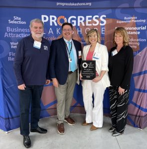 Tom Vesser from Froedtert Holy Family Memorial presented Cool City Brewing Company with Honorable Mention in Neighborhood Development.