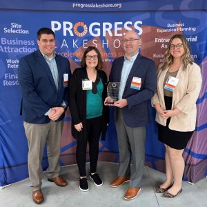 Katie Selner from Fox Communities Credit Union presented Nicolet National Bank with the Economic Accelerator of the Year Award.